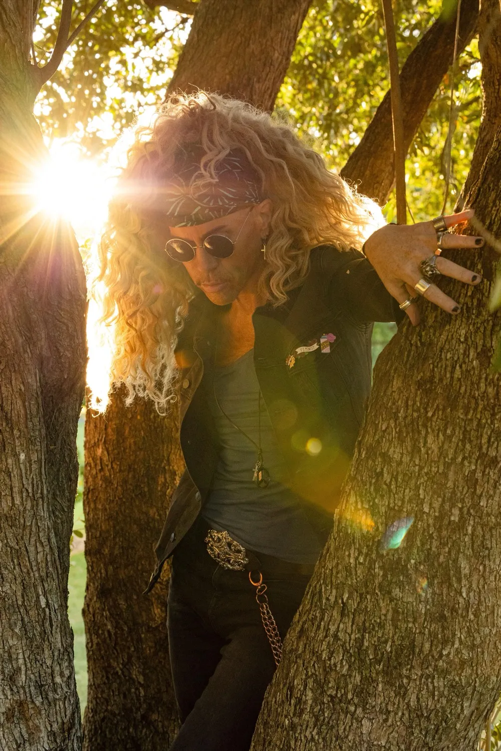 Markus Hamence among the branches of a tree at golden hour