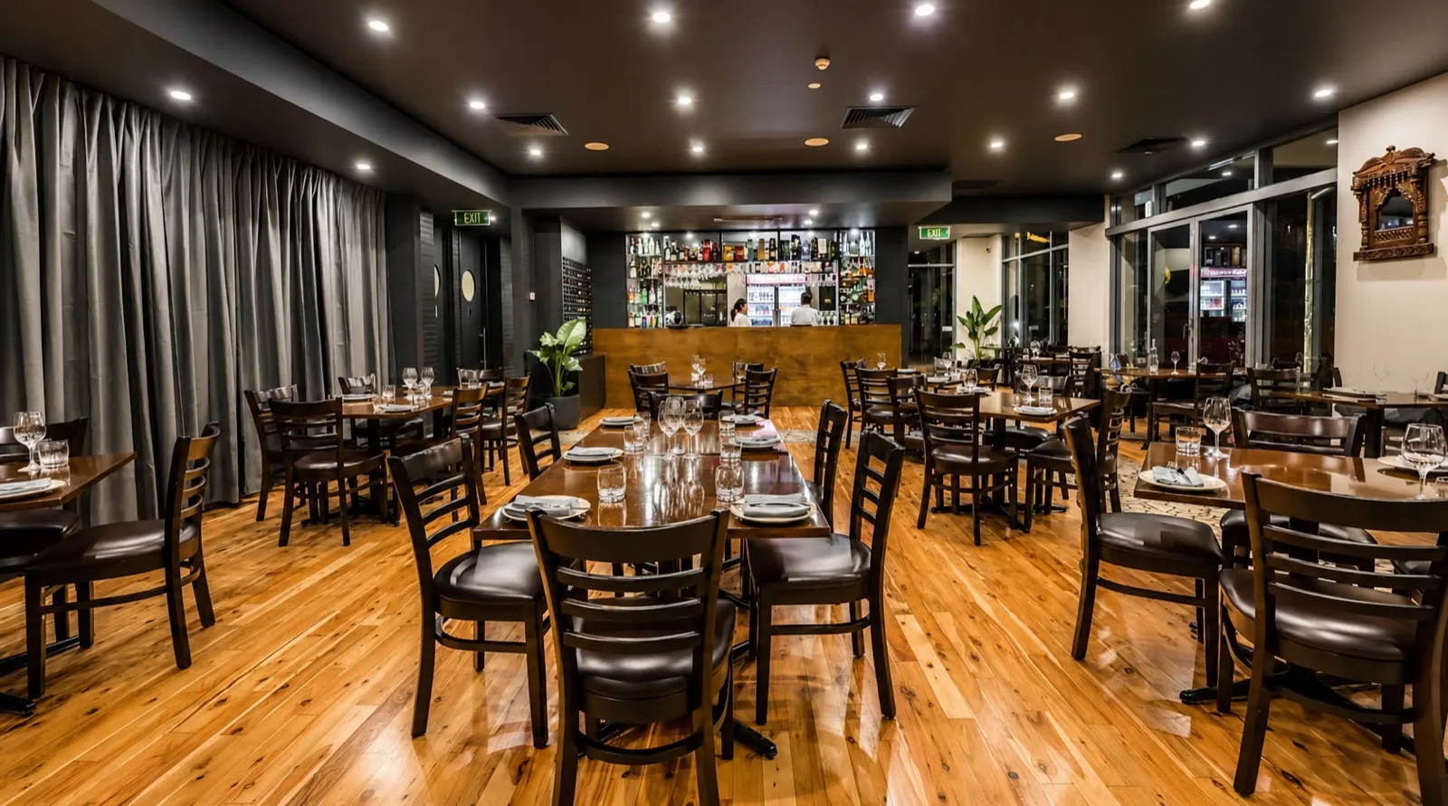 A warmly lit restaurant dining room designed by Markus Hamence